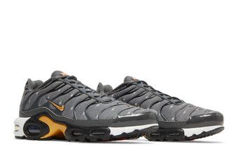 gold and black nike tn