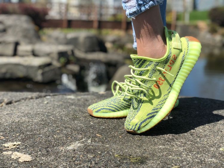 frozen yellow yeezys on feet