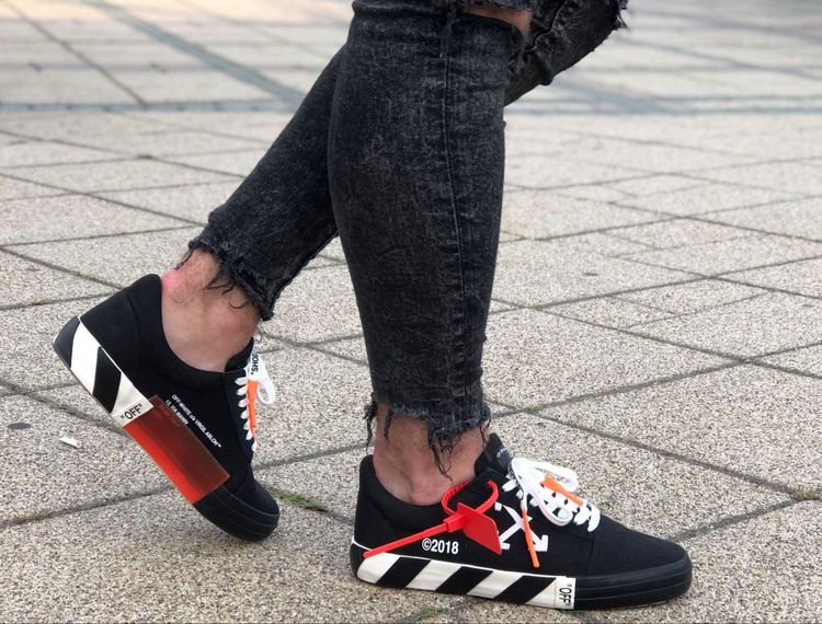 off white vulc low top on feet
