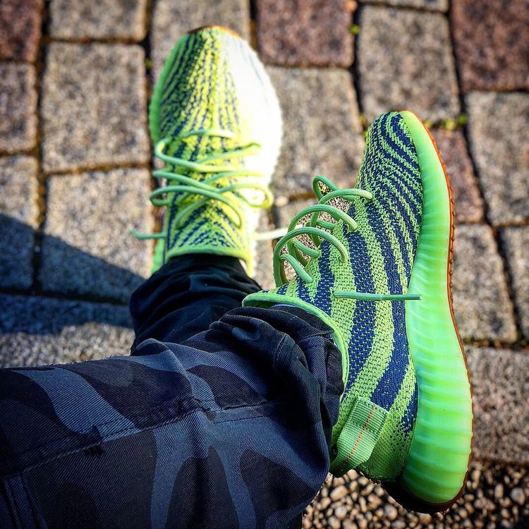 frozen yellow yeezys on feet