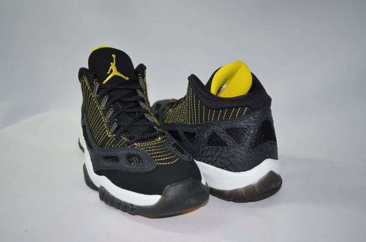 black and yellow jordan 11s