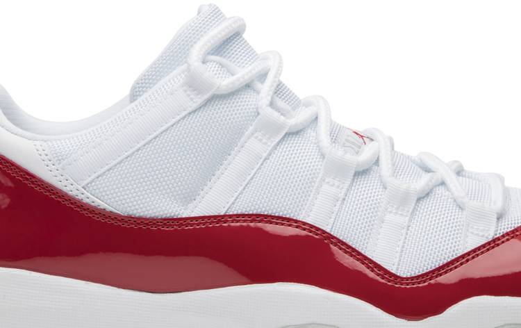 red and white jordan 11's