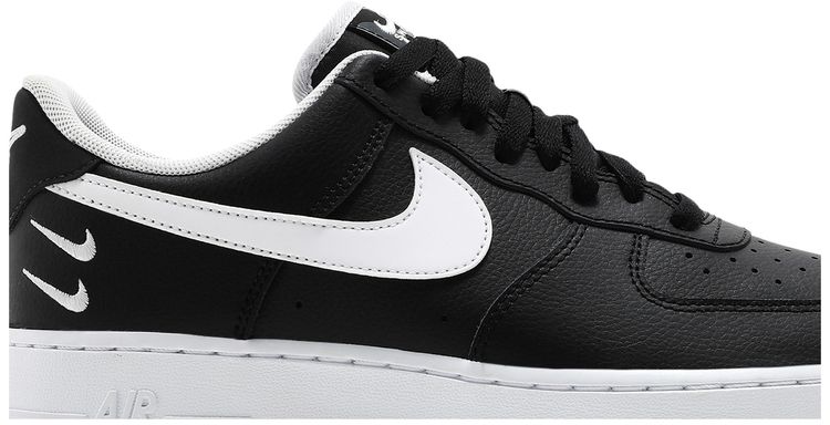 white nike with black swoosh