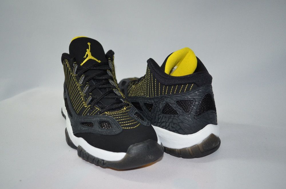 Black and yellow jordans 11 shop