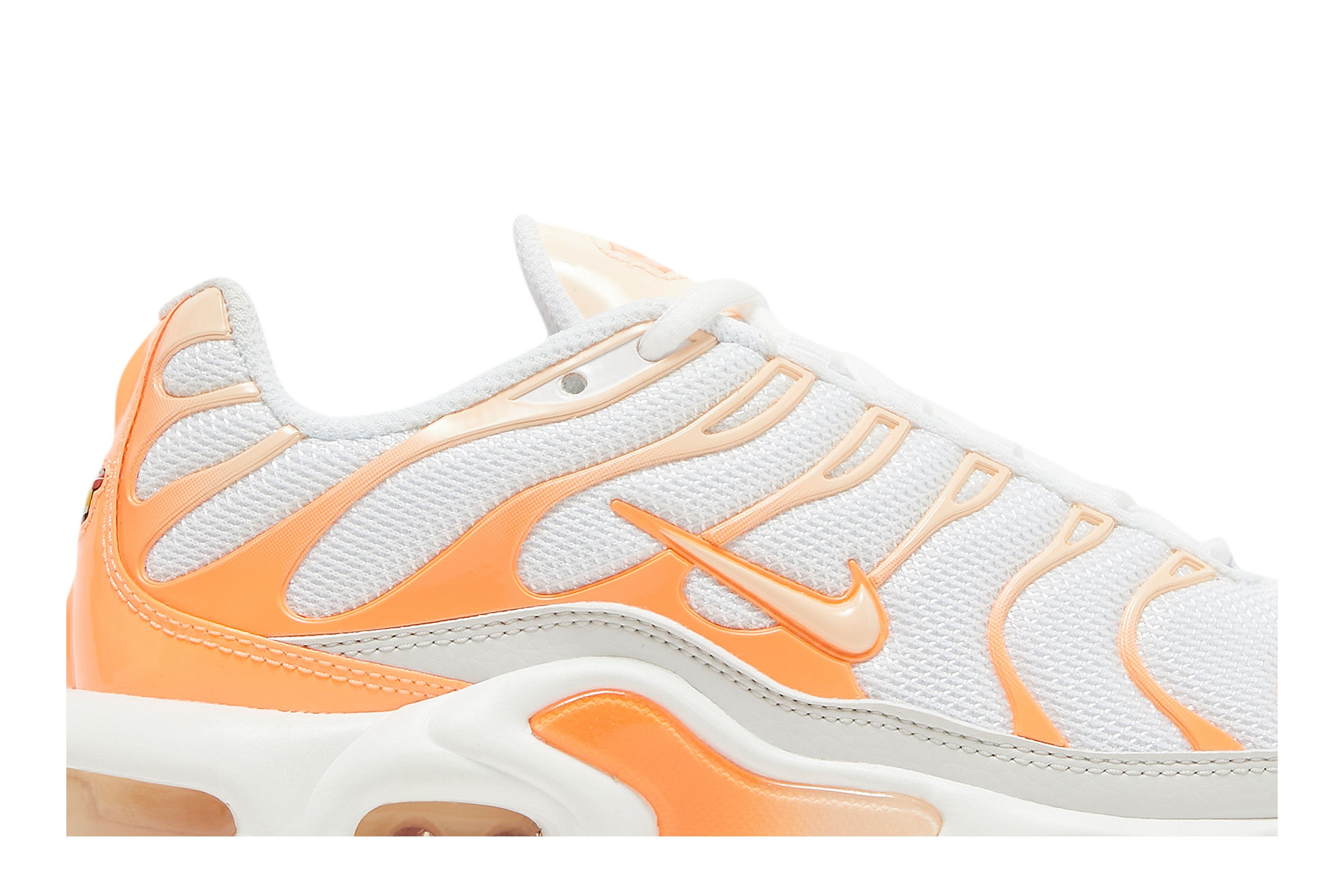 white and orange air max plus