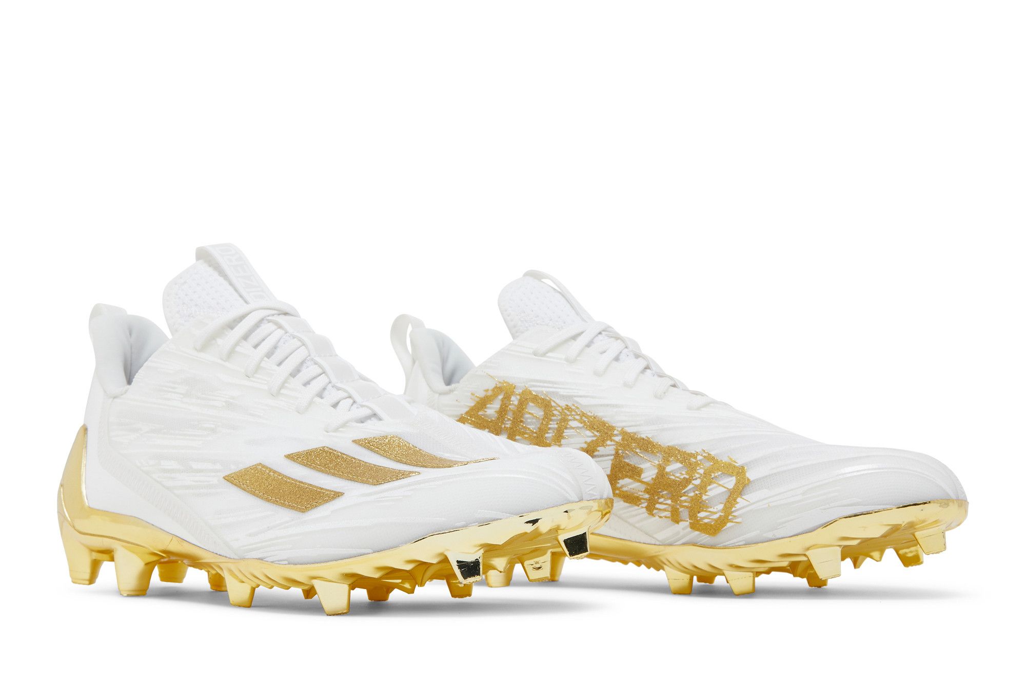 white and gold football cleats