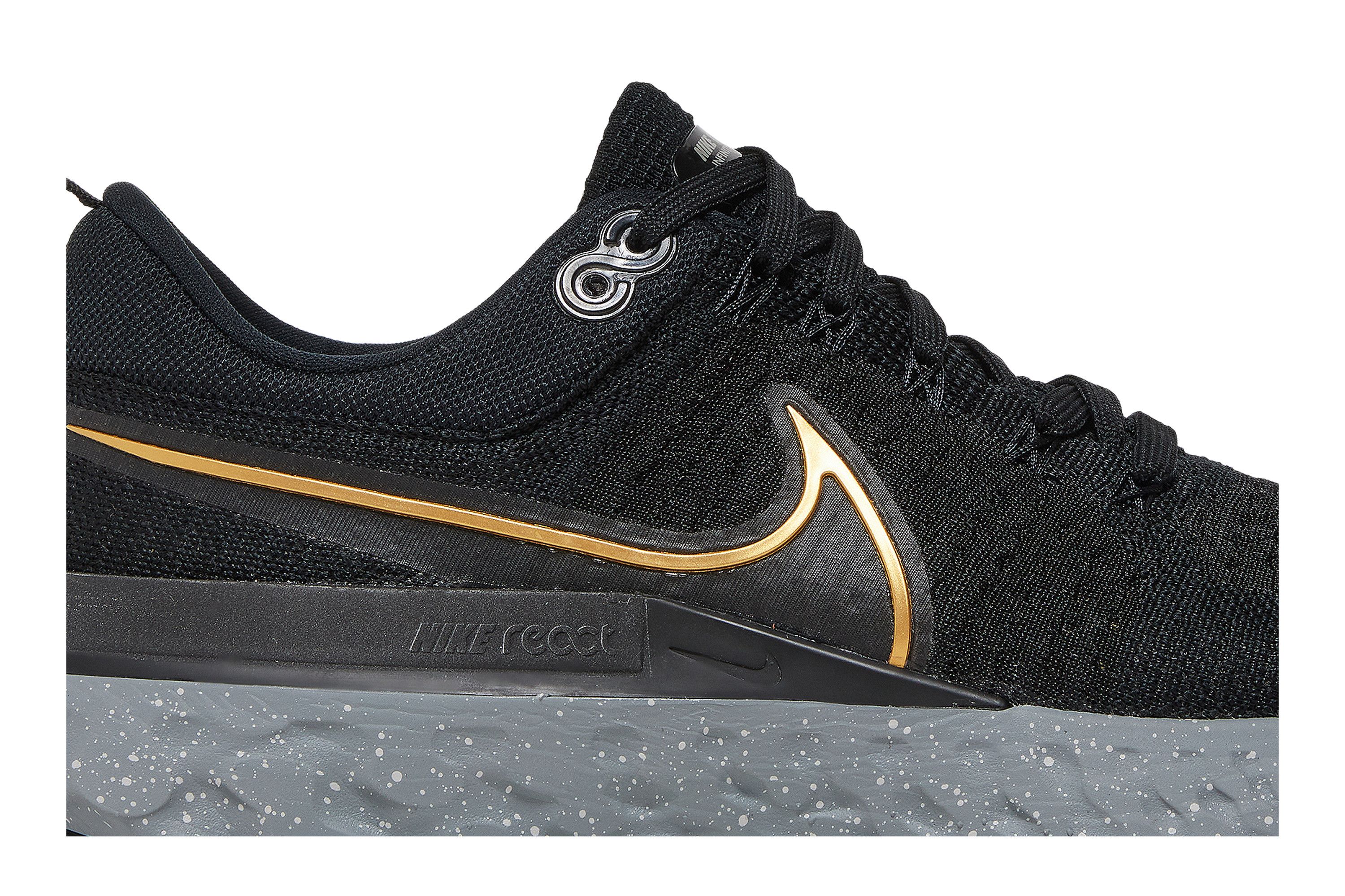 Nike flyknit black and gold top