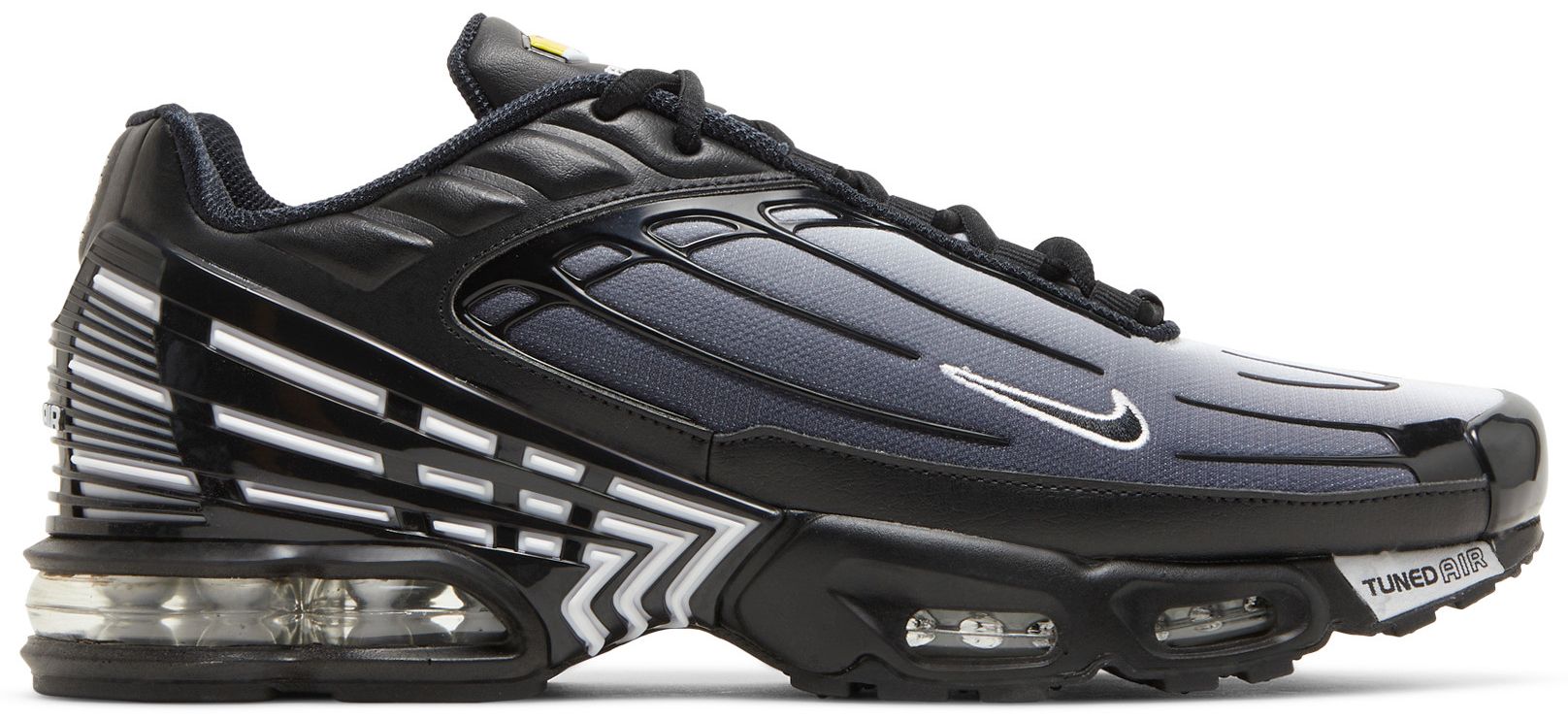 white and black air max plus