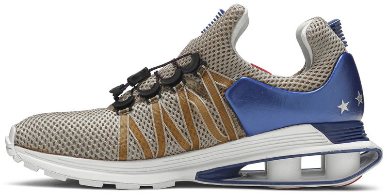 shox gravity metallic gold