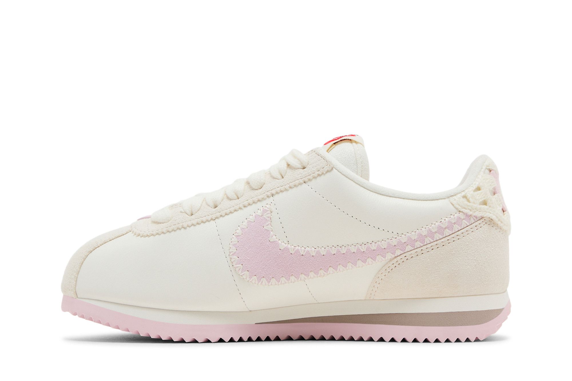 white and pink nike cortez