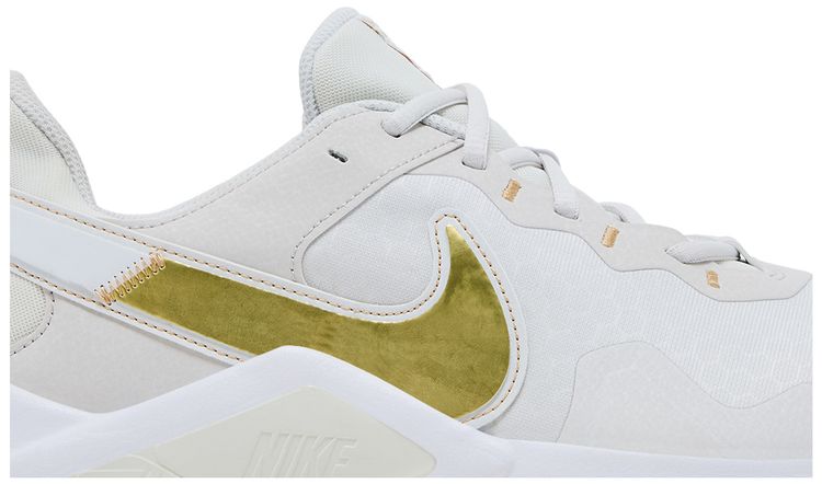 Nike Wmns Legend Essential 2 Platinum Tint Metallic Gold Star
