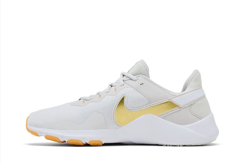 Nike Wmns Legend Essential 2 Platinum Tint Metallic Gold Star