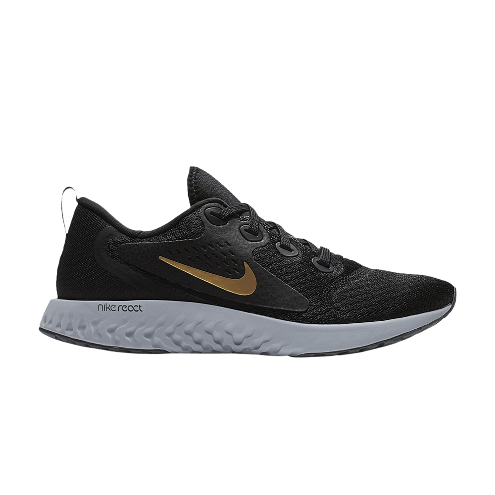 nike legend react black and gold