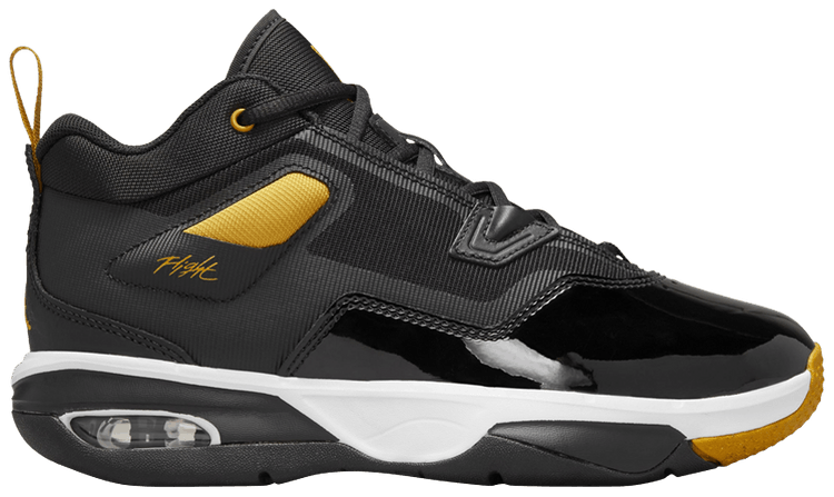 Black and yellow flight jordans top