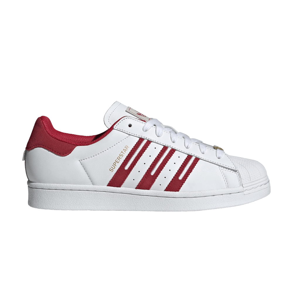 white adidas with maroon stripes
