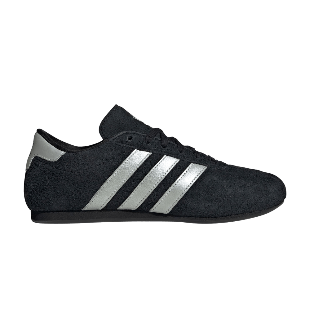 black adidas with silver stripes